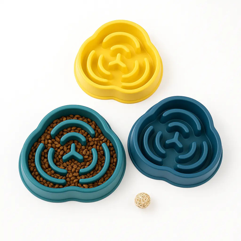 Yellow, blue, and green dog bowls with kibble on white background